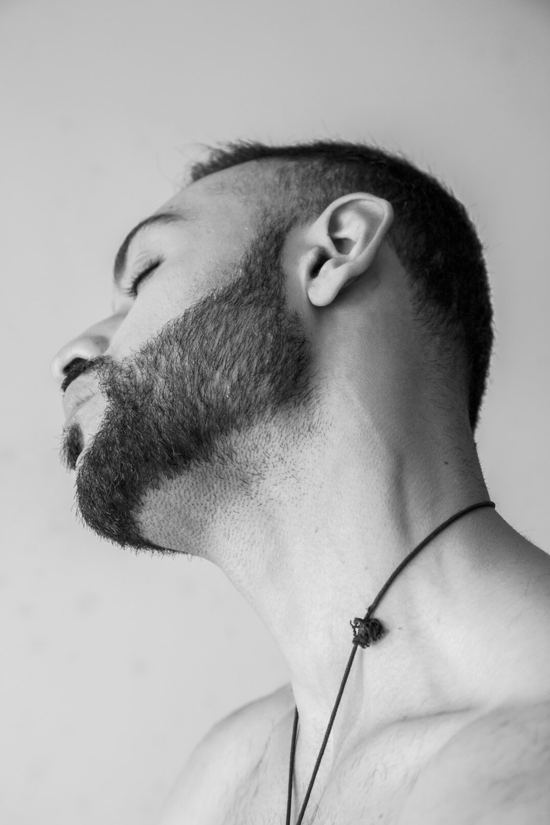 Portrait of a bearded man with a camera around his neck
